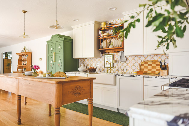 CliqStudios project: Light cream shaker kitchen cabinets with green and floral Scandinavian accents