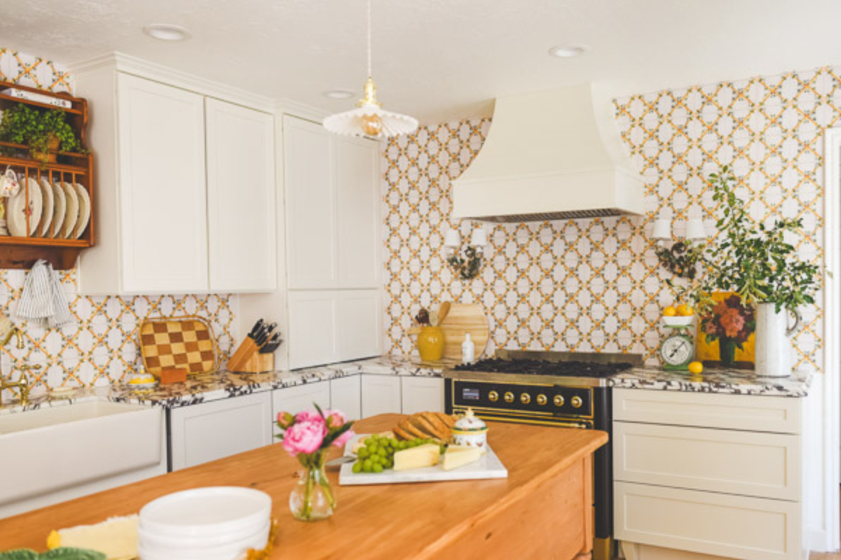 Light cream shaker kitchen design with Scandinavian flare and large wood center table