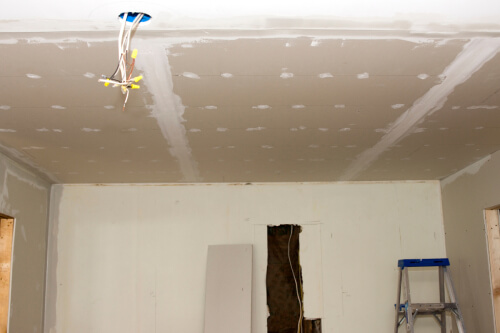 Mudded and taped unfinished ceilings with exposed wires