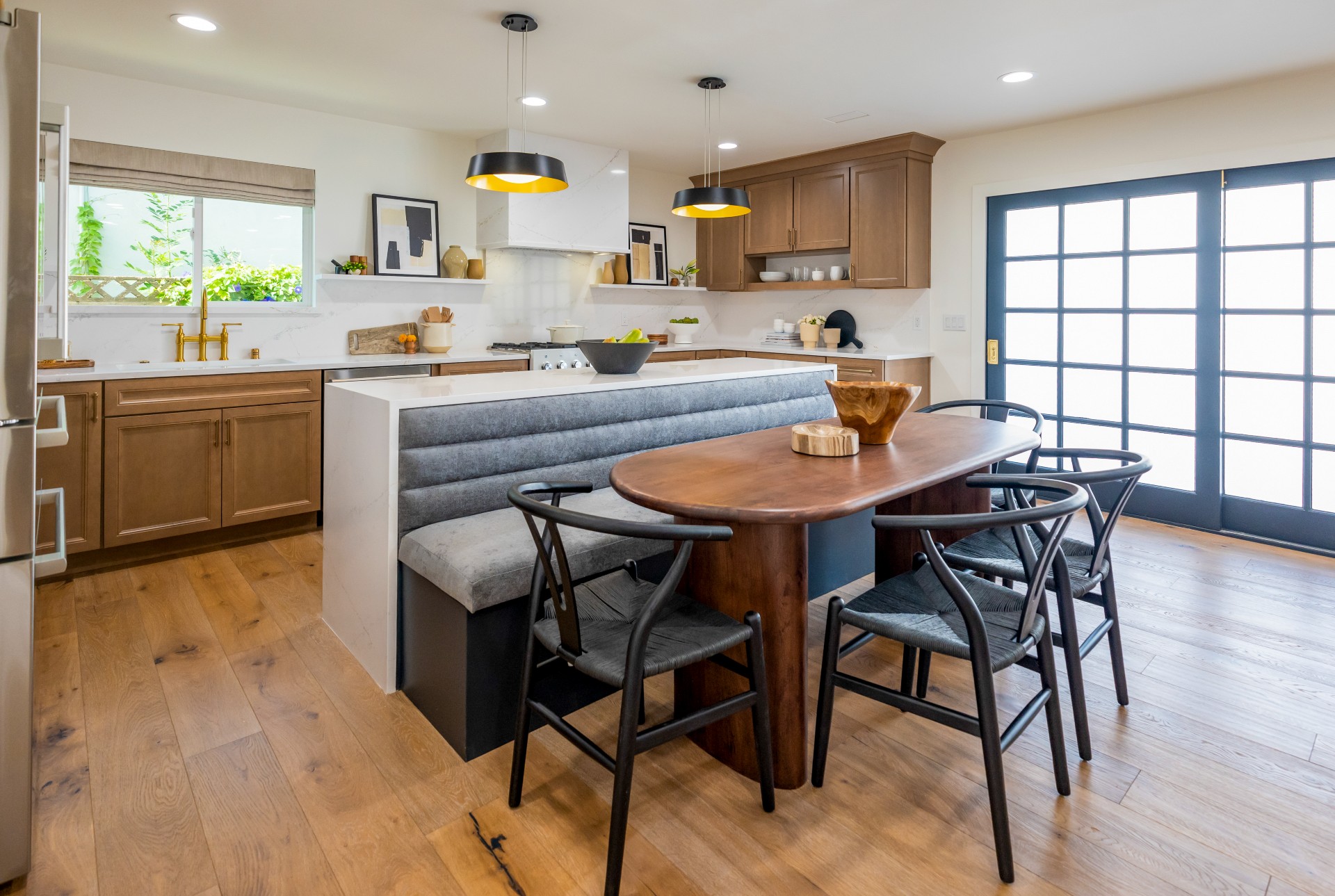 CliqStudios project: Detailed wood shaker door kitchen cabinets with indigo colored island cabinets and white quartz waterfall countertops