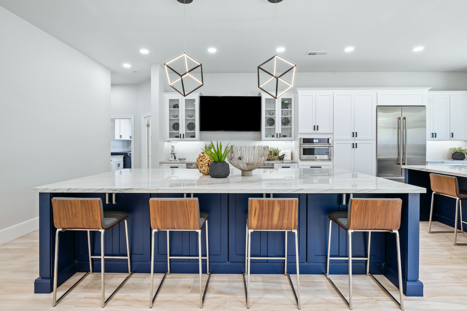 CliqStudios project: White shaker kitchen with two navy blue kitchen islands