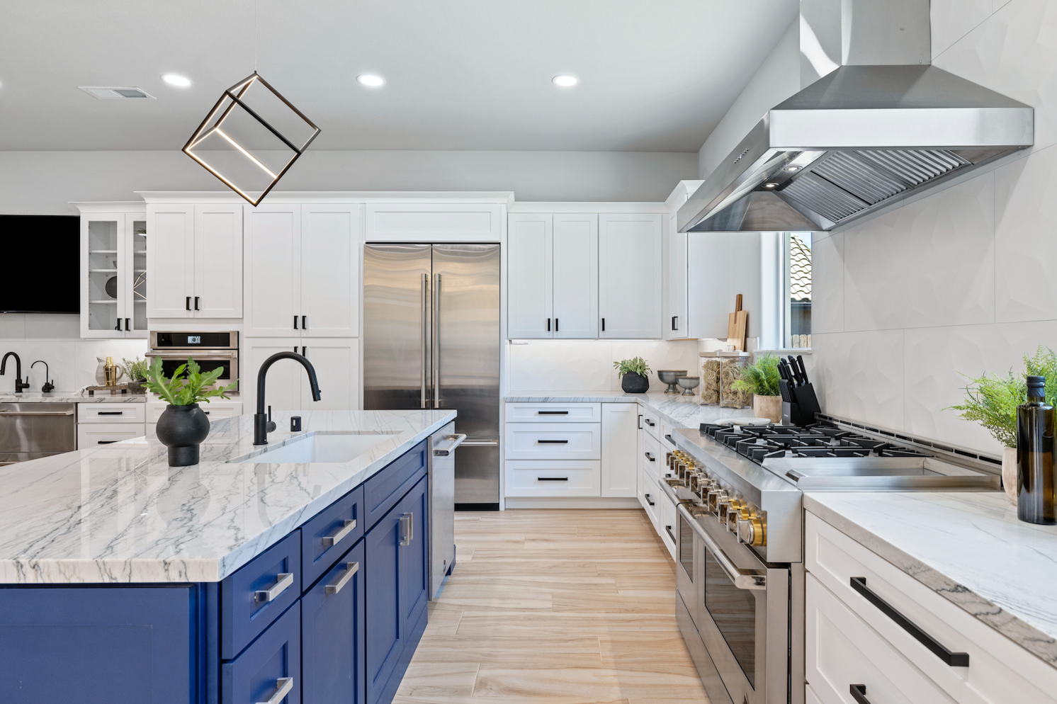 CliqStudios project: White shaker kitchen with two navy blue kitchen islands
