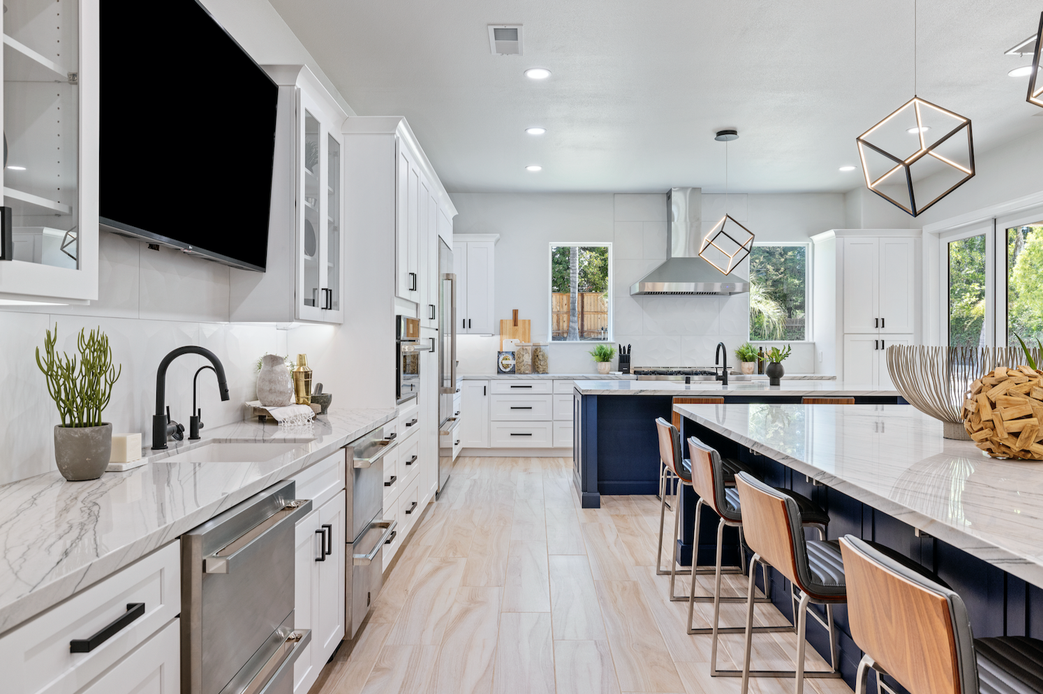 CliqStudios project: White shaker kitchen with two navy blue kitchen islands