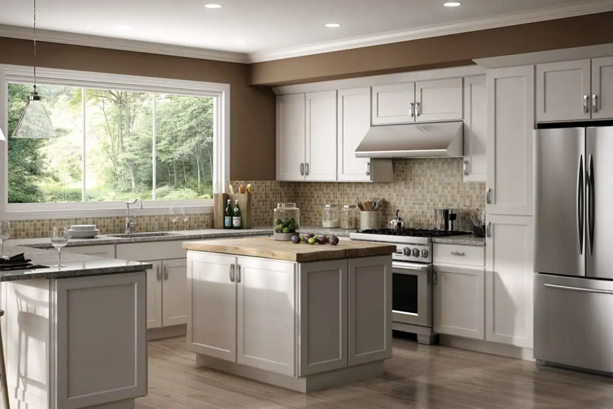 U-shaped white shaker kitchen with a peninsula and island, light brown countertops, and medium brown wall paint