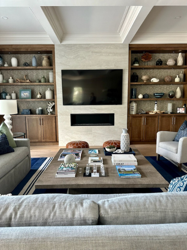 Dark brown stained shaker bookcase cabinets with floating shelves above