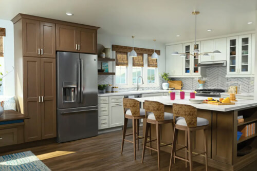 White and medium tone wood kitchen cabinets with glass wall cabinets