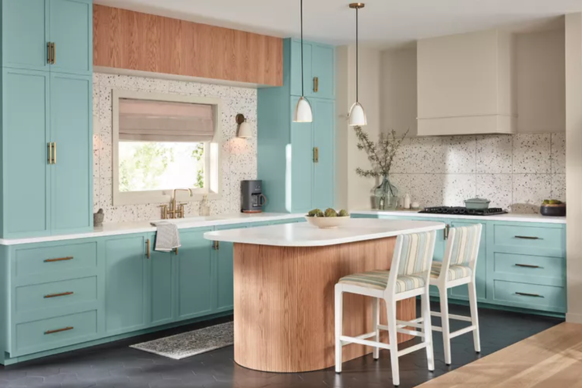 Aqua blue kitchen cabinets with shaker door style and light wood island