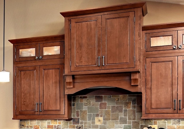 range hood in cherry with glass-front cabinets