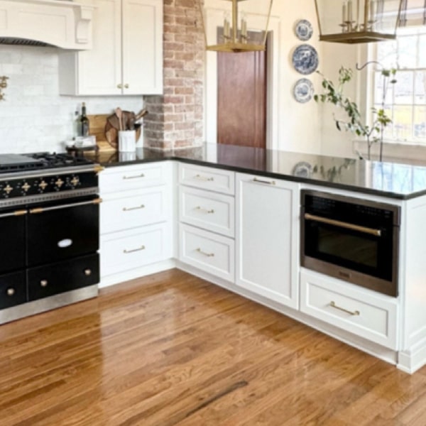 White shaker kitchen with built-in microwave