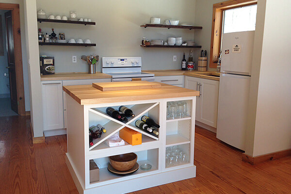 This image is of mini bar cabinet in a house. If you have a smaller home and want to incorporate a wet bar design into your kitchen, a mini bar cabinet is the best choice for you.