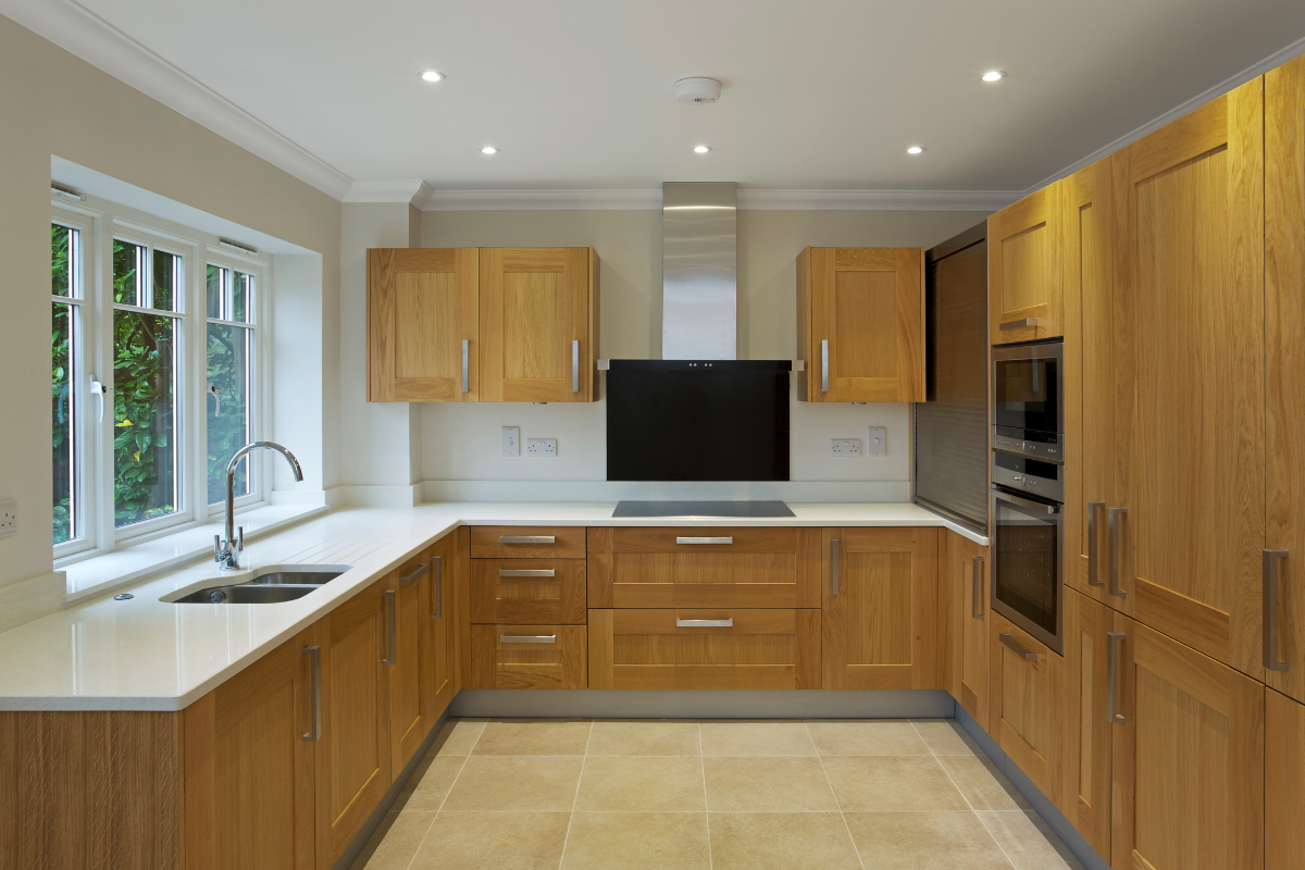 U-shaped kitchen layout with white oak cabinets