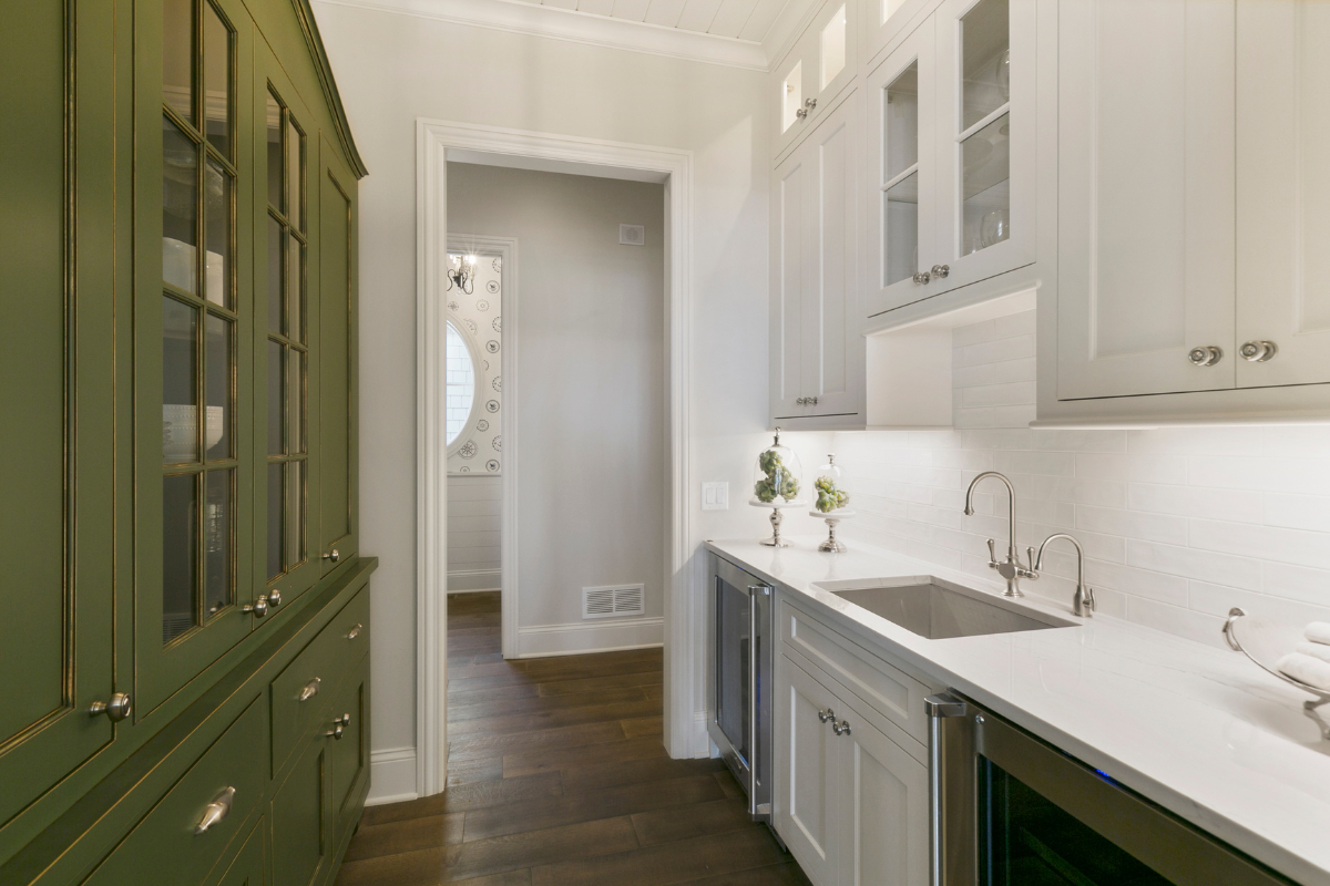 White and green inset cabinets in a butlers pantry