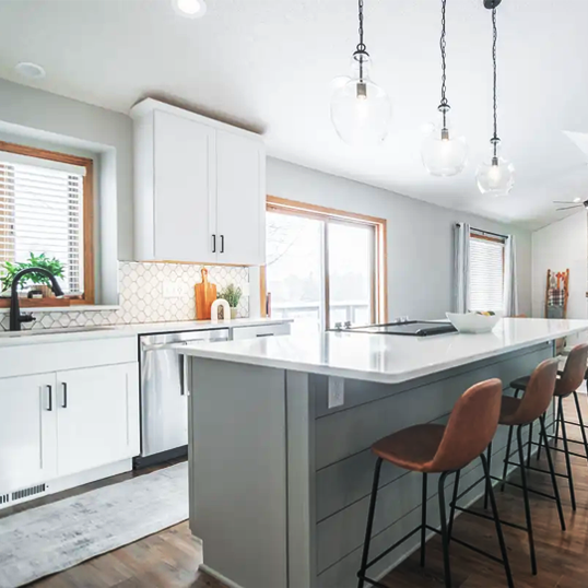 Black and white kitchen with shaker with large pantry wall