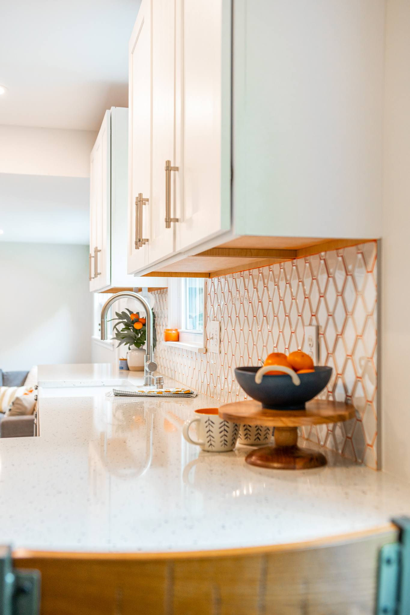 CliqStudios project: White shaker kitchen wall cabinets with white tile backsplash and orange grout