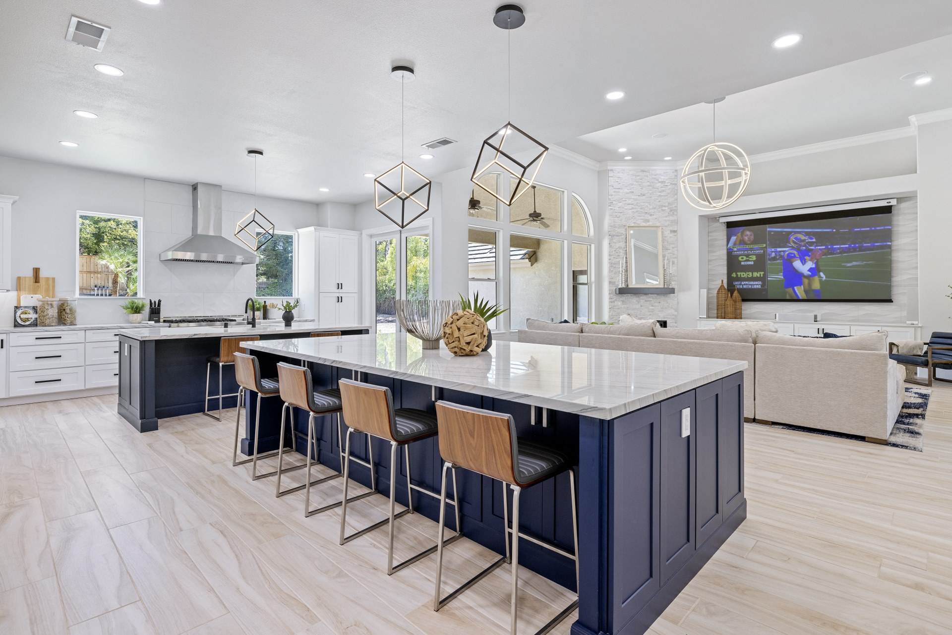 White shaker kitchen with two navy blue kitchen islands