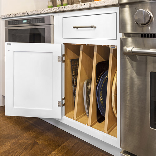 Tray divider base kitchen cabinet with top drawer in inset white shaker door style