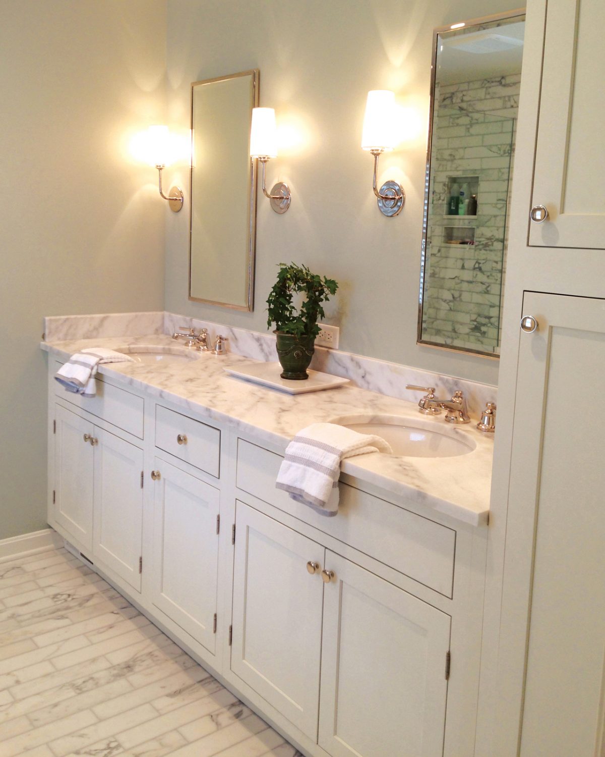 CliqStudios bath cabinets shown in Shaker White door style and finish