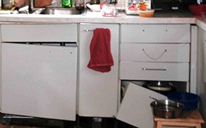 White MDF cabinets with broken drawer and hanging door