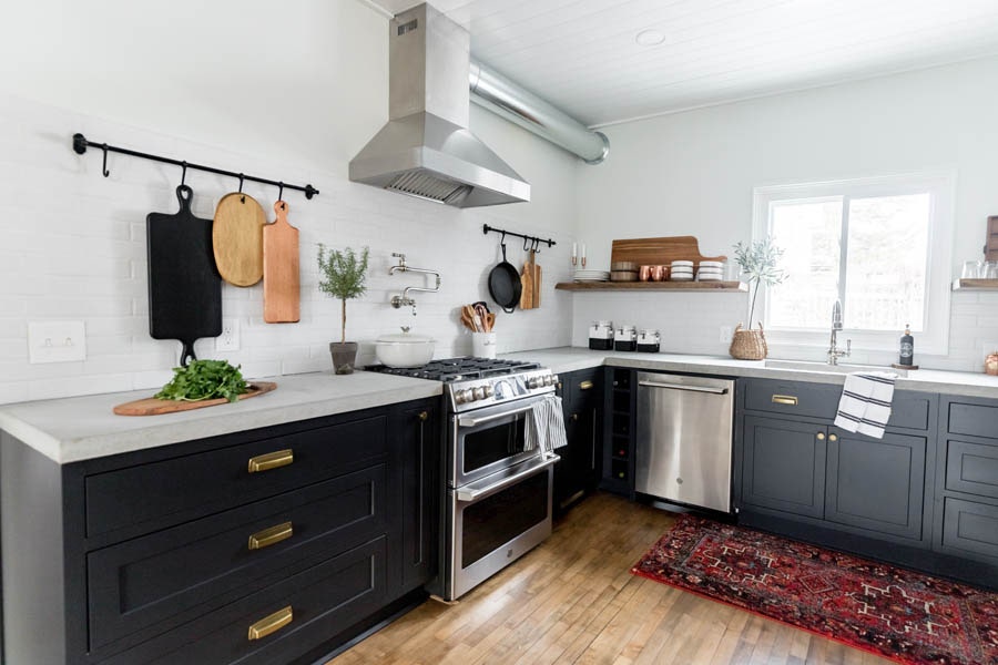 A rustic modern kitchen using black, inset cabinetry.