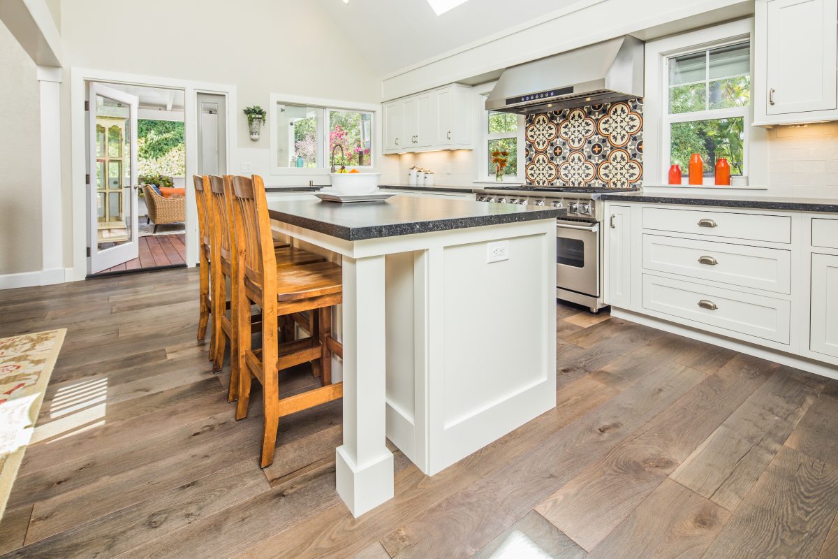 Large White Kitchen Island with Dark Countertop