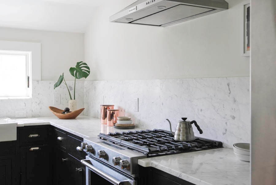 Black Cabinets with White Countertops and Walls