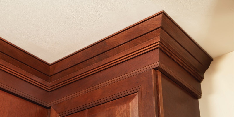 Decorative stained in medium wood stain with Traditional Molding