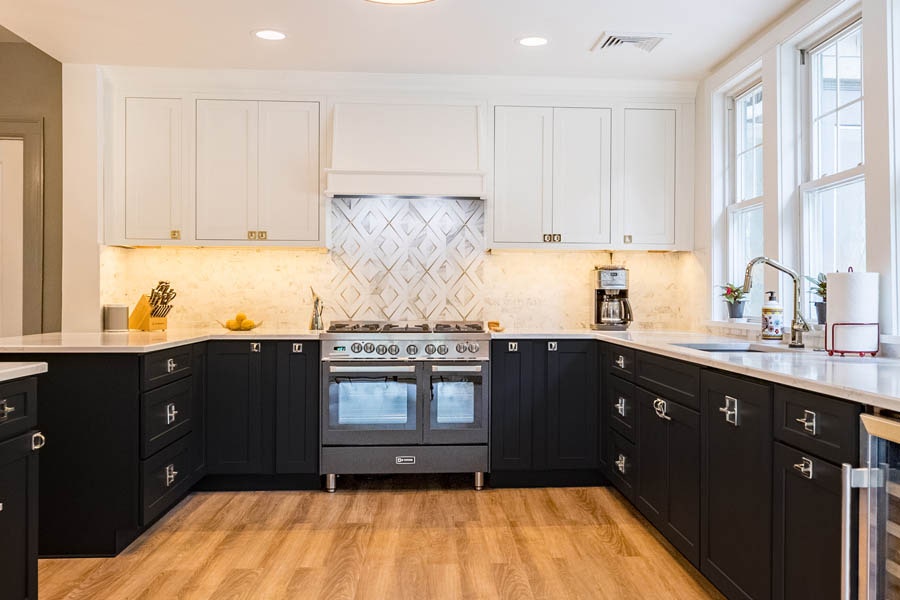 A black and white kitchen using CliqStudios Shaker cabinets, black the base cabinets and white above.