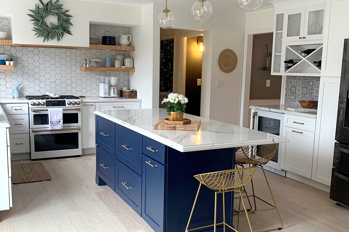 CliqStudios project: Shaker white kitchen cabinets with a blue shaker island and matching white appliances