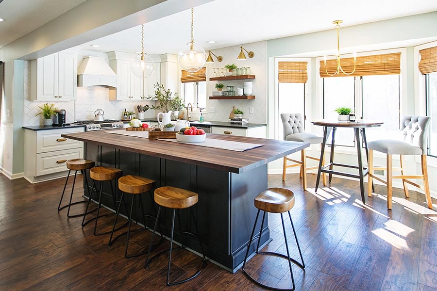 Decorative white and shaker black kitchen cabinets with butcher block countertop