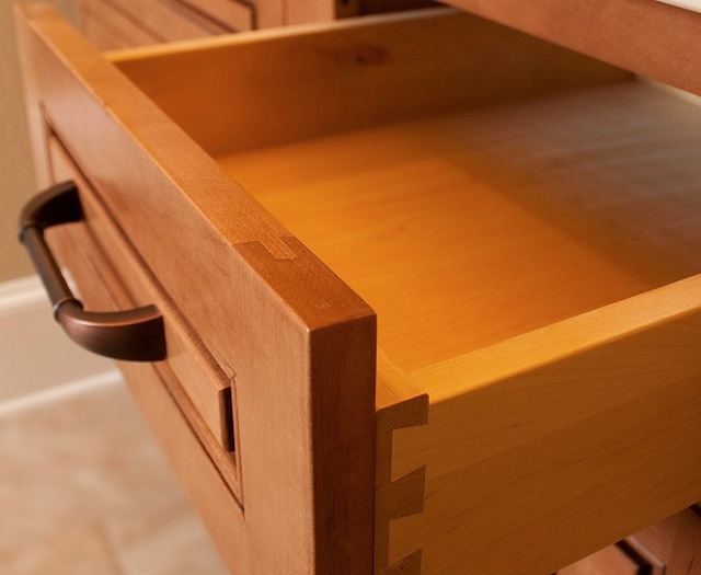 maple cabinets showing dovetail drawer with concealed glides