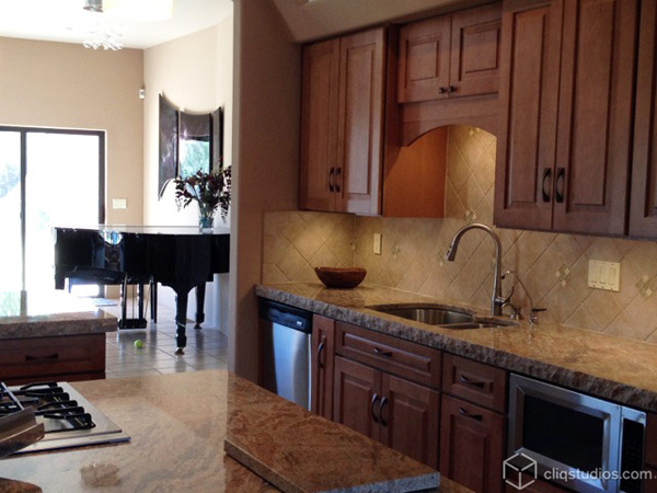 Maple kitchen cabinets by sink area