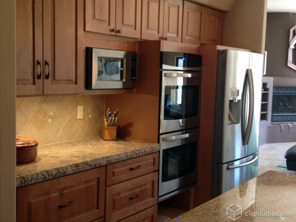 Maple kitchen cabinets by oven area