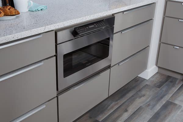 CliqStudios Slab cabinets painted in Medium Gray, microwave shelf