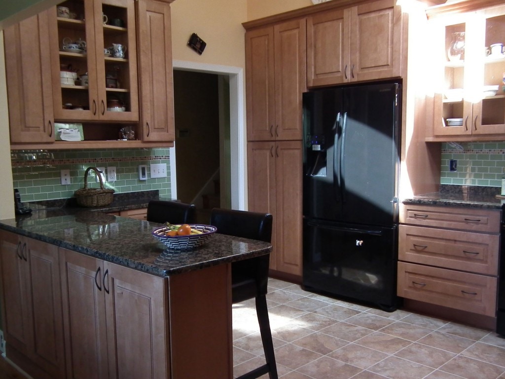 Cherry cabinets in kitchen with peninsula facing out