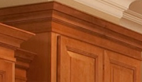 top of maple cabinets trimmed with deep crown molding