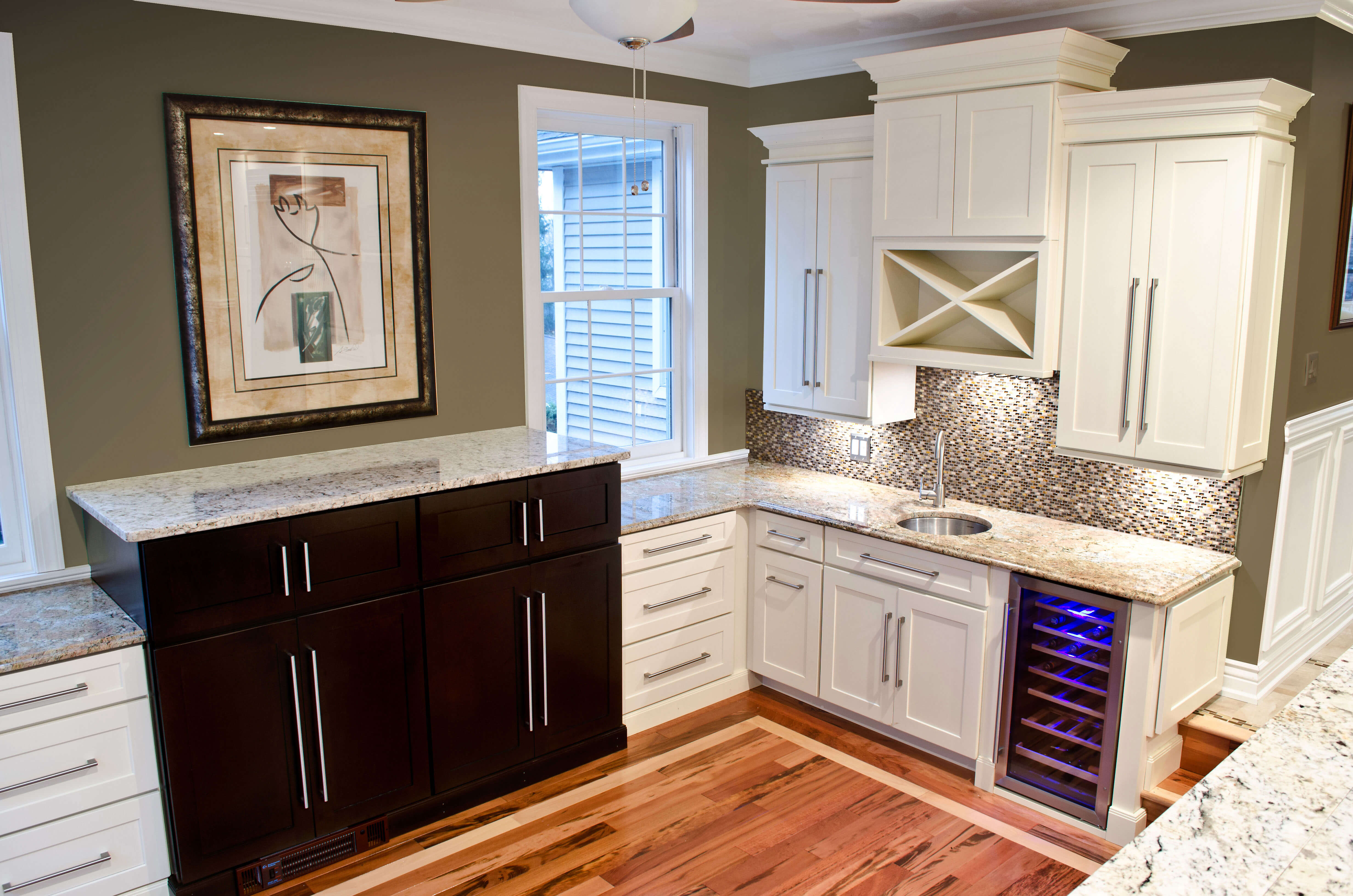 The image is of bar cabinets in a house. Bar cabinets are a beautiful and smart addition to any modern home renovation.