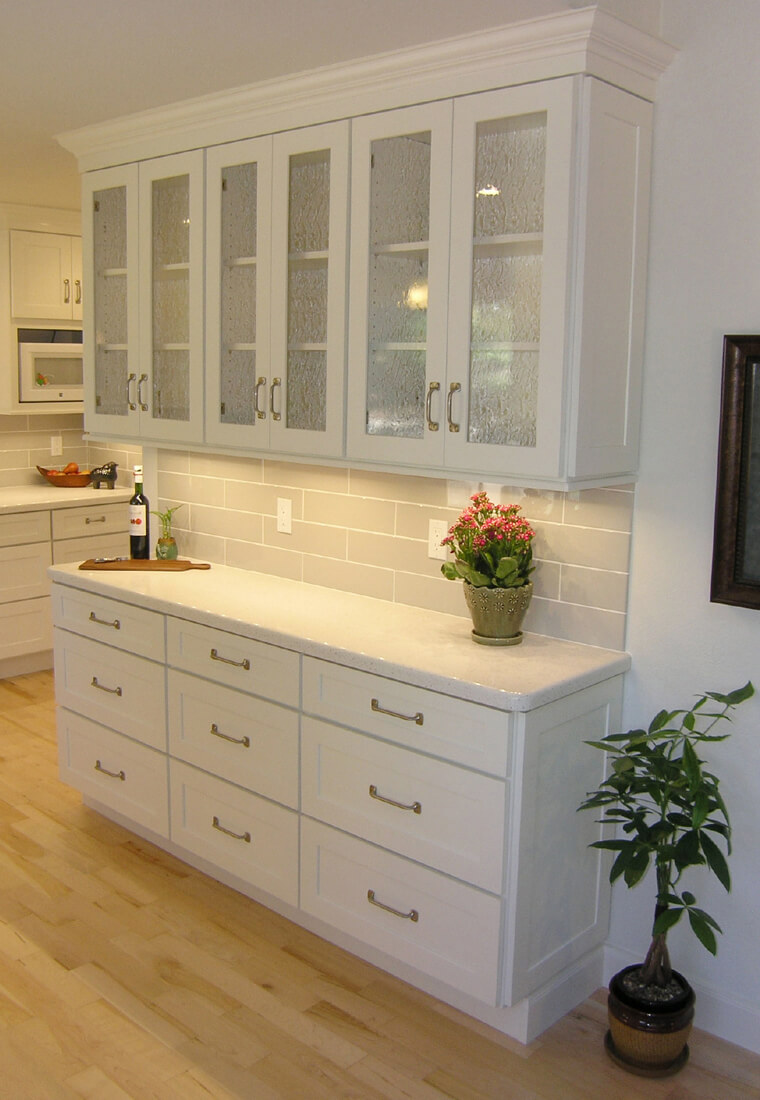 This image is of a white bar cabinet in a house. If you are drawn to a fresh, light, and airy design, then white bar cabinets will be an excellent addition to your home.