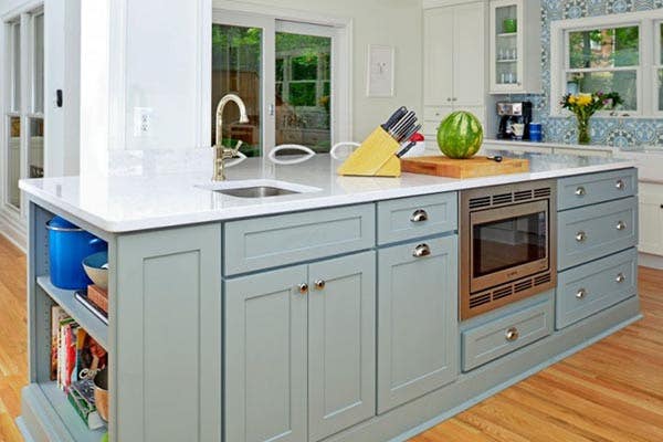 large kitchen island finished in Blue-Gray with a white countertop