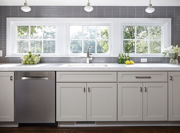 Bright, open and neat as a pin, the clean-up zone in this kitchen uses a strategic assortment of storage solutions to keep clutter out of sight.