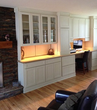 Library wall and computer workstation built from white shaker cabinets