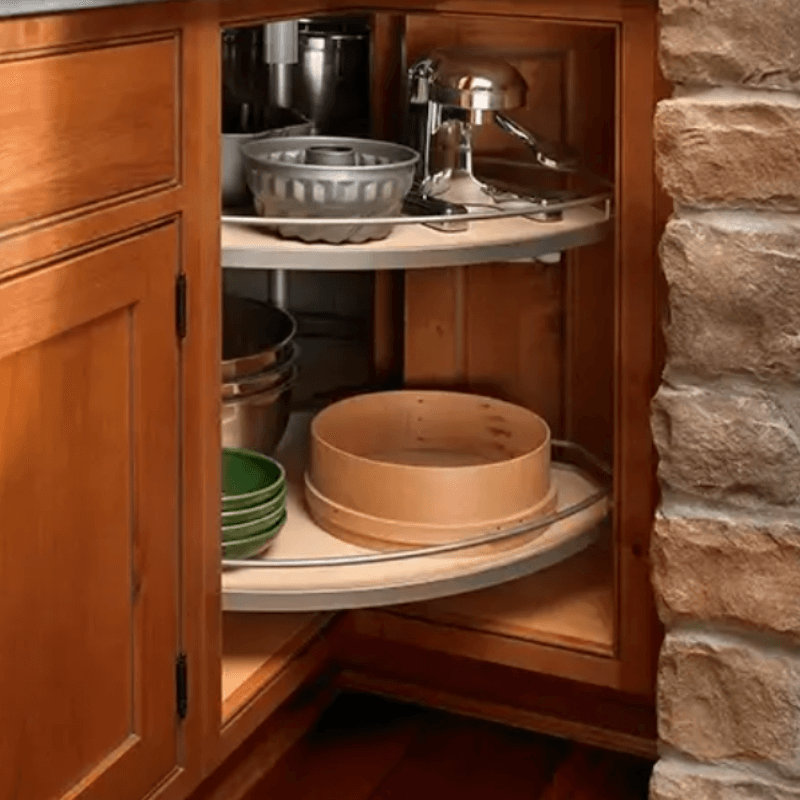 Lazy susan storage with two wood spinning trays and metal rails.