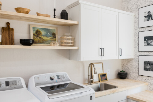 White shaker laundry room cabinets