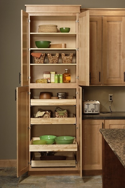 maple pantry cabinet with open doors shows rollout shelves