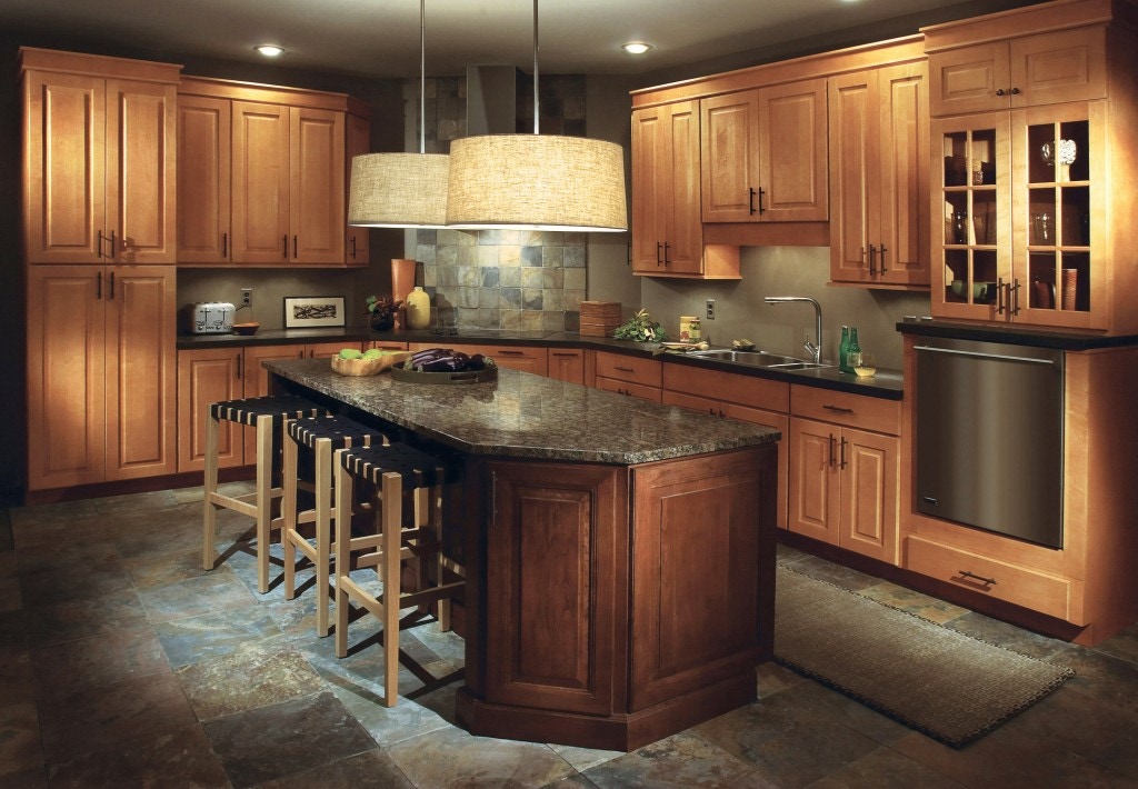 cherry island with raised panel style and black granite countertop