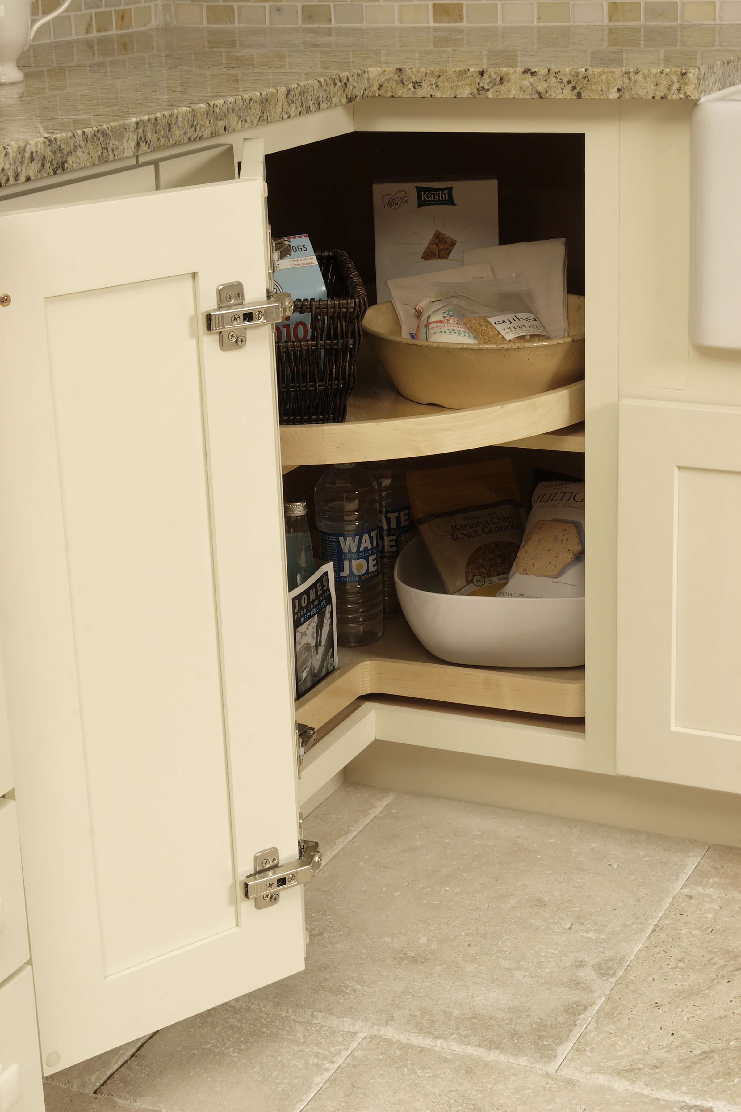 This image is of corner shelves for extra pantry space. A kitchen corner cabinet is a wonderful place to store these extra pantry items.