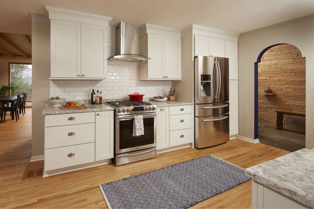 Kitchen Wall with Shaker Door Style Stainless Oven and Refrigerator