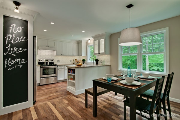 White kitchen with interesting wood flooring