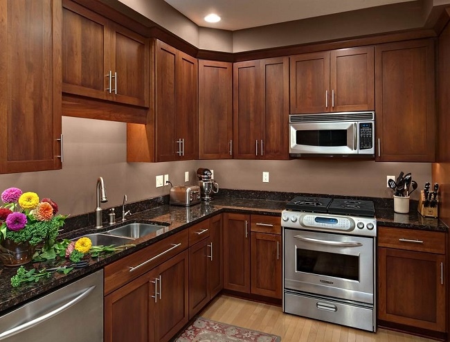 cherry cabinets with undercabinet countertop task lighting