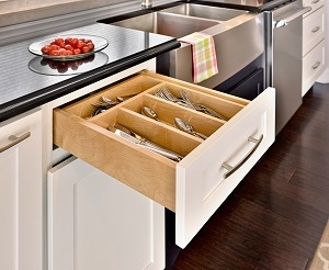 silverware drawer open to show hardwood dividers in white cabinets